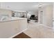 Spacious loft area with hardwood floors and views into the living area at 19065 Malinche Loop, Spring Hill, FL 34610