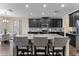 Modern kitchen with island, granite countertops, and stainless steel appliances at 19065 Malinche Loop, Spring Hill, FL 34610