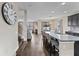 Open concept kitchen with island, granite countertops, and stainless steel appliances at 19065 Malinche Loop, Spring Hill, FL 34610