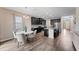 Open kitchen features dark cabinetry, stainless steel appliances, and an island at 19065 Malinche Loop, Spring Hill, FL 34610