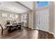 Bright dining room with hardwood floors, chandelier, and modern table at 19065 Malinche Loop, Spring Hill, FL 34610