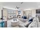 Open concept living room with hardwood floors and large windows at 19065 Malinche Loop, Spring Hill, FL 34610