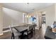 Bright dining room with hardwood floors, chandelier, and modern table at 19065 Malinche Loop, Spring Hill, FL 34610