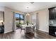 Dining area with backyard view and hardwood floors at 19065 Malinche Loop, Spring Hill, FL 34610