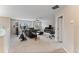 Open loft with leather sectional, exercise equipment, and plenty of natural light at 19065 Malinche Loop, Spring Hill, FL 34610