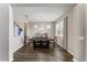 Bright dining room with hardwood floors, chandelier, and modern table at 19065 Malinche Loop, Spring Hill, FL 34610