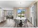Casual dining area with backyard access and hardwood floors at 19065 Malinche Loop, Spring Hill, FL 34610