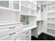 Custom walk-in closet with shelves, drawers, and hanging space at 920 N Osceola Ave # 703, Clearwater, FL 33755