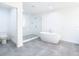 Modern bathroom with a large soaking tub and a glass shower at 920 N Osceola Ave # 703, Clearwater, FL 33755