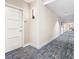 Building hallway with carpeted floor and modern wall sconces at 920 N Osceola Ave # 703, Clearwater, FL 33755