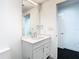 Simple bathroom with a white vanity and a large mirror at 920 N Osceola Ave # 703, Clearwater, FL 33755