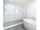 Spa-like bathroom with soaking tub and large glass shower at 920 N Osceola Ave # 703, Clearwater, FL 33755
