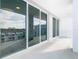 Spacious balcony with sliding glass doors and city views at 920 N Osceola Ave # 703, Clearwater, FL 33755