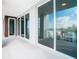 Private balcony with glass doors and water views at 920 N Osceola Ave # 703, Clearwater, FL 33755