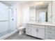 Bathroom with white vanity, quartz countertop and a glass shower at 920 N Osceola Ave # 703, Clearwater, FL 33755