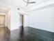 Main bedroom with dark hardwood floors and a closet with barn door at 920 N Osceola Ave # 703, Clearwater, FL 33755