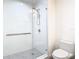 Walk-in shower with glass enclosure and gray tile floor at 920 N Osceola Ave # 703, Clearwater, FL 33755