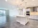Modern kitchen with white cabinets, stainless steel appliances, and quartz countertops at 920 N Osceola Ave # 703, Clearwater, FL 33755