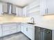 Modern kitchen with white cabinets, stainless steel appliances, and quartz countertops at 920 N Osceola Ave # 703, Clearwater, FL 33755