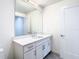 Clean bathroom with white cabinets and a quartz countertop at 920 N Osceola Ave # 703, Clearwater, FL 33755