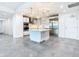Modern kitchen with island, stainless steel appliances, and white shaker cabinets at 920 N Osceola Ave # 703, Clearwater, FL 33755