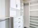 Well-organized closet with upper cabinets and drawers at 920 N Osceola Ave # 703, Clearwater, FL 33755