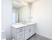 Modern bathroom with white vanity and a large mirror at 920 N Osceola Ave # 703, Clearwater, FL 33755