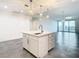 Modern kitchen with white island, stainless steel appliances, and pendant lighting at 920 N Osceola Ave # 703, Clearwater, FL 33755