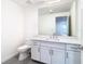 Modern bathroom featuring a white vanity and large mirror at 920 N Osceola Ave # 703, Clearwater, FL 33755
