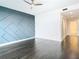 Spacious bedroom with dark hardwood floors and a modern accent wall at 920 N Osceola Ave # 703, Clearwater, FL 33755