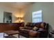 Living area featuring brown leather sofa and wood coffee table at 3507 N 12Th St, Tampa, FL 33605