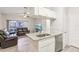Open concept kitchen with granite countertops and stainless steel appliances at 13113 Sanctuary Cove Dr # 104, Temple Terrace, FL 33637