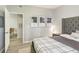 Main bedroom featuring a comfy bed and view of the dining area at 13113 Sanctuary Cove Dr # 104, Temple Terrace, FL 33637