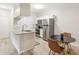 Modern kitchen with a breakfast bar and stainless steel appliances at 13113 Sanctuary Cove Dr # 104, Temple Terrace, FL 33637