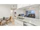 Eat-in kitchen featuring granite countertops and a view of the living room at 13113 Sanctuary Cove Dr # 104, Temple Terrace, FL 33637