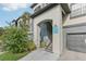 Exterior view of building entrance with stairs and garage at 13113 Sanctuary Cove Dr # 104, Temple Terrace, FL 33637