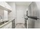 Modern kitchen features stainless steel appliances and granite countertops at 13113 Sanctuary Cove Dr # 104, Temple Terrace, FL 33637