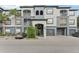 Exterior of a two-story building with gray and blue accents at 13113 Sanctuary Cove Dr # 104, Temple Terrace, FL 33637