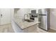 Kitchen features granite countertops and stainless steel appliances at 13113 Sanctuary Cove Dr # 104, Temple Terrace, FL 33637
