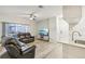 Spacious living room with hardwood floors and a ceiling fan at 13113 Sanctuary Cove Dr # 104, Temple Terrace, FL 33637