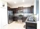 Modern kitchen with stainless steel appliances and granite countertops at 10438 Shady Preserve Dr, Riverview, FL 33578