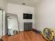 Home gym with mirror, tv, and various exercise equipment at 5047 Silver Charm Ter, Wesley Chapel, FL 33544