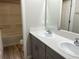 Bathroom with double vanity and a tub at 13116 Shumard Way, Riverview, FL 33579