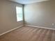 Well-lit bedroom featuring carpeted floors and a window at 13116 Shumard Way, Riverview, FL 33579