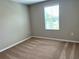 Well-lit bedroom featuring carpeted floors and a window at 13116 Shumard Way, Riverview, FL 33579