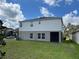 Two-story house with backyard and screened patio at 13116 Shumard Way, Riverview, FL 33579