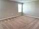 Spacious bedroom with plush carpeting and a large window at 13116 Shumard Way, Riverview, FL 33579
