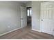 Bedroom with neutral walls, carpet, and door to another room at 13116 Shumard Way, Riverview, FL 33579