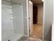 Bathroom with shower and walk-in closet access at 13116 Shumard Way, Riverview, FL 33579
