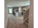 Open living room and kitchen with carpeted floor at 13116 Shumard Way, Riverview, FL 33579